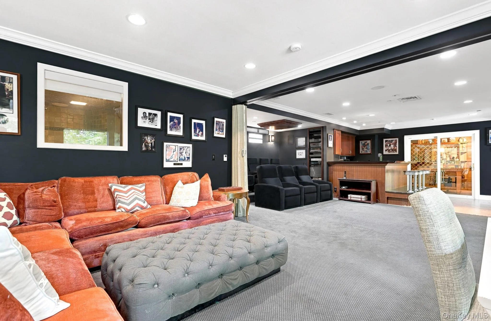 Family room, home theater with retractable wall for privacyBar/kitchen with built-in stools Family room, home theater with retractable wall for privacyBar/kitchen with built-in stools