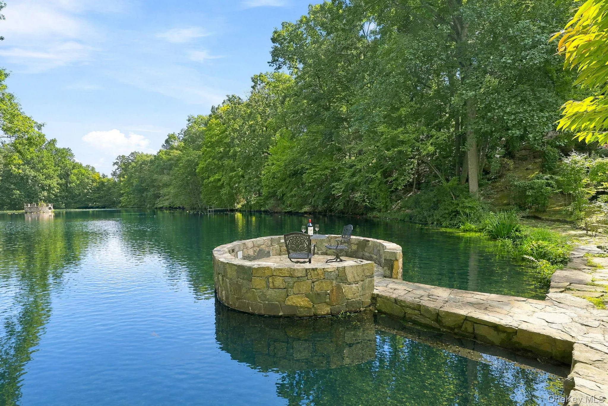 Stone patio can be turned into gazebo on the lake. Glass panels included Stone patio can be turned into gazebo on the lake. Glass panels included