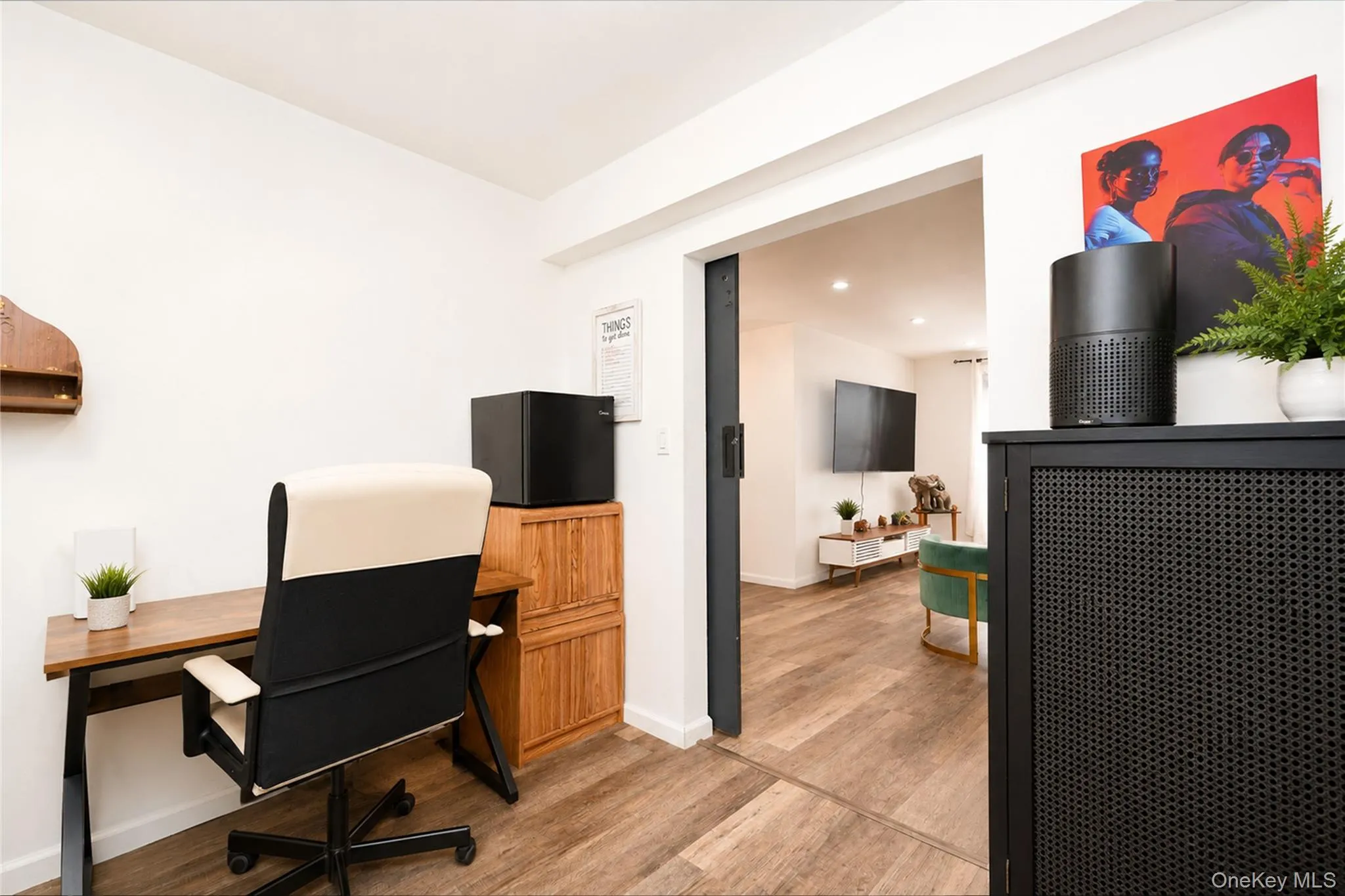 Dedicated workspace featuring wood-finish flooring Dedicated workspace featuring wood-finish flooring