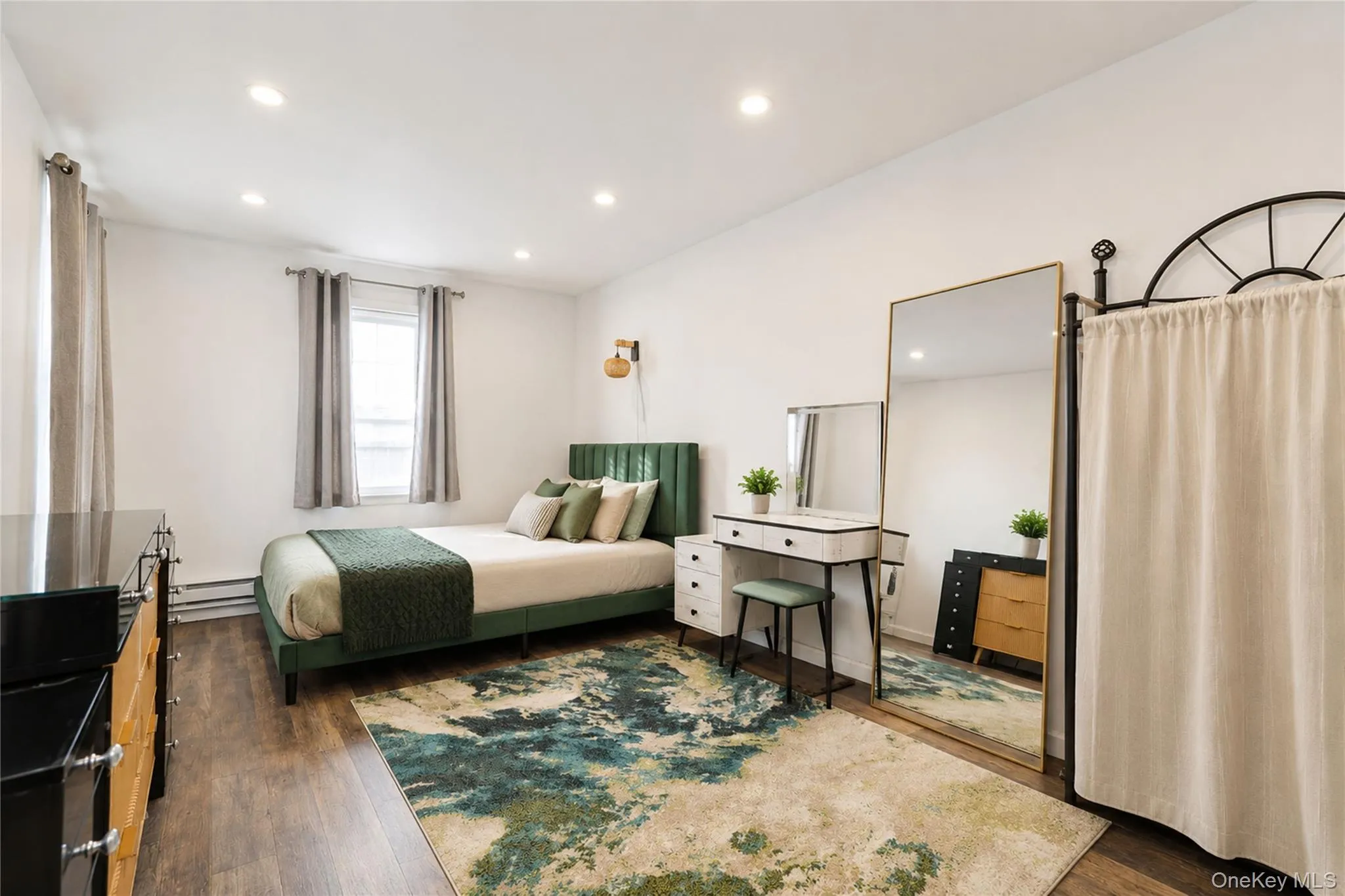 Room featuring wood-finish flooring and recessed ceiling lighting Room featuring wood-finish flooring and recessed ceiling lighting
