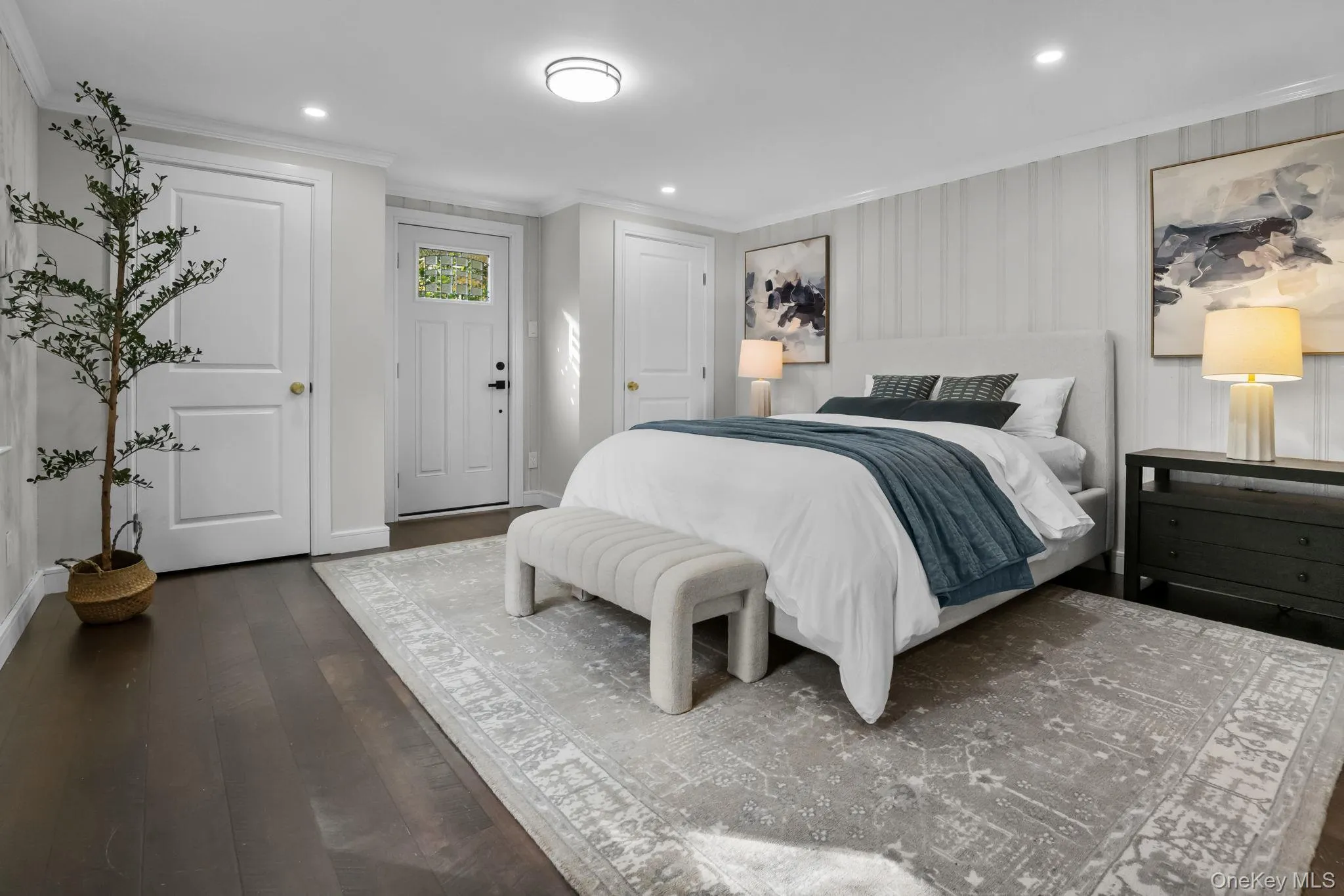 Primary bedroom with private exterior entrance offering convenient access to the yard and outdoor living space. Primary bedroom with private exterior entrance offering convenient access to the yard and outdoor living space.