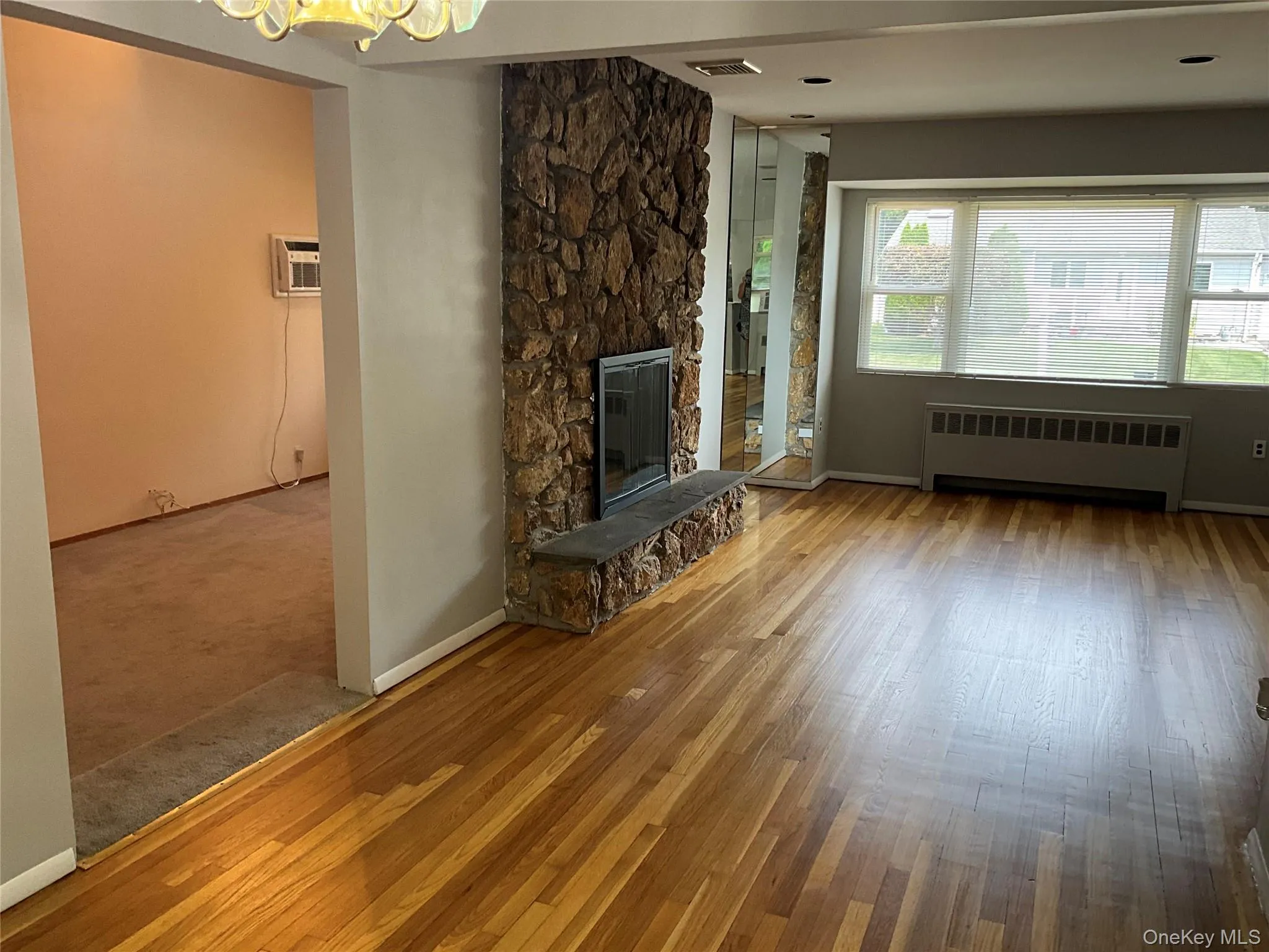 Showing opening to den with shared fireplace. Showing opening to den with shared fireplace.