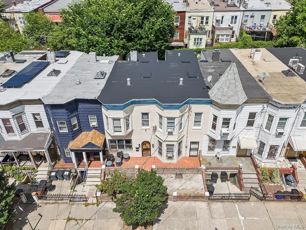 Aerial view showing the full footprint of this classic Belmont property, featuring a new roof and distinctive architectural details. Aerial view showing the full footprint of this classic Belmont property, featuring a new roof and distinctive architectural details.