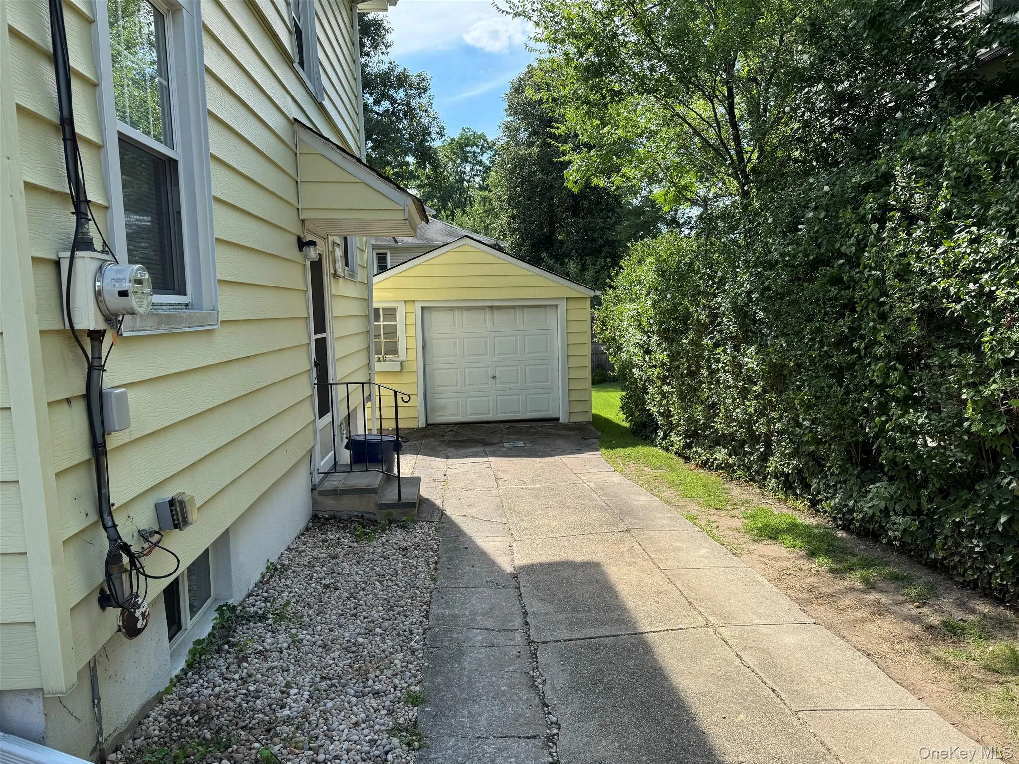 One car garage and driveway One car garage and driveway