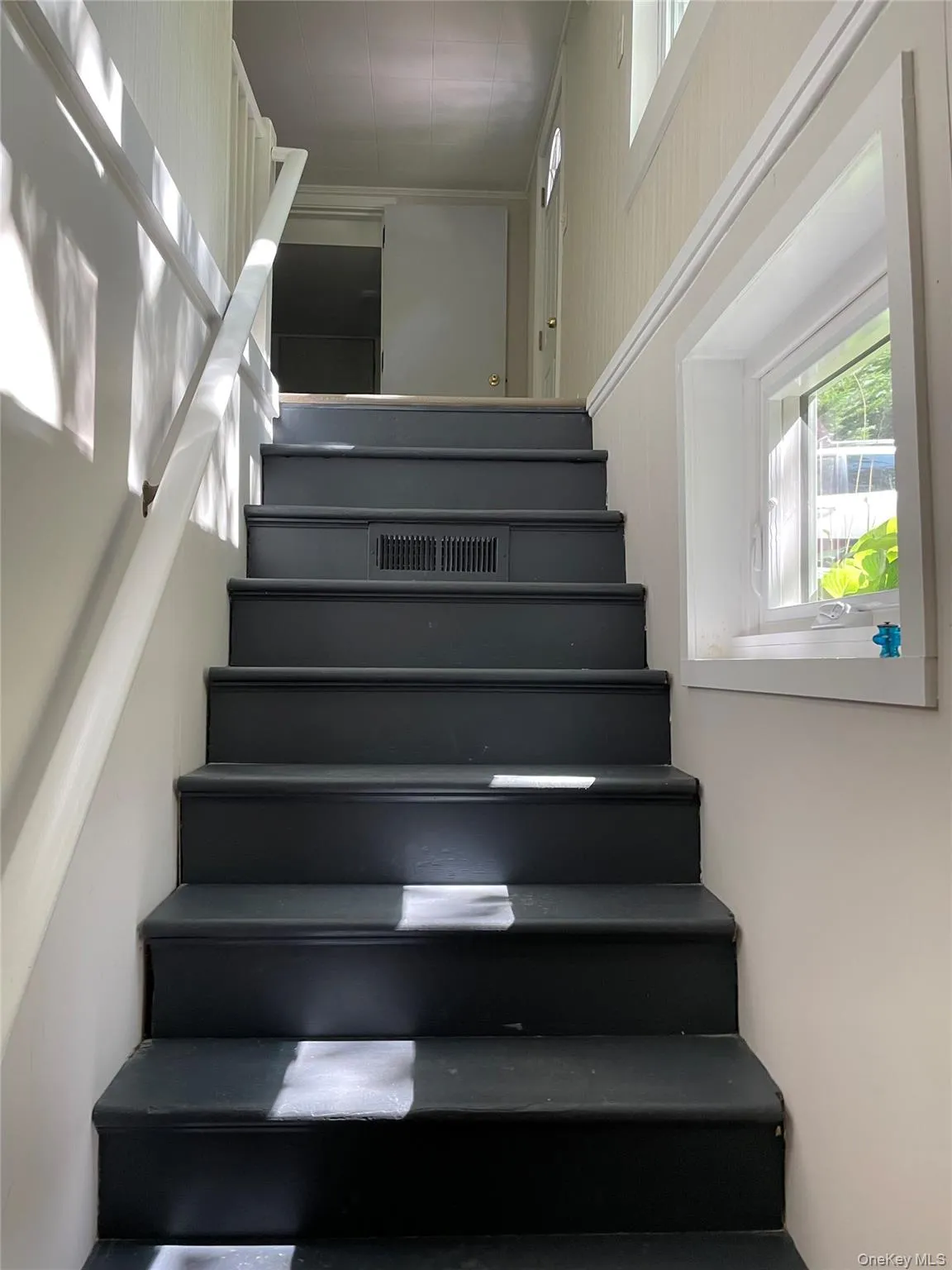 stairs to kitchen and living room area stairs to kitchen and living room area