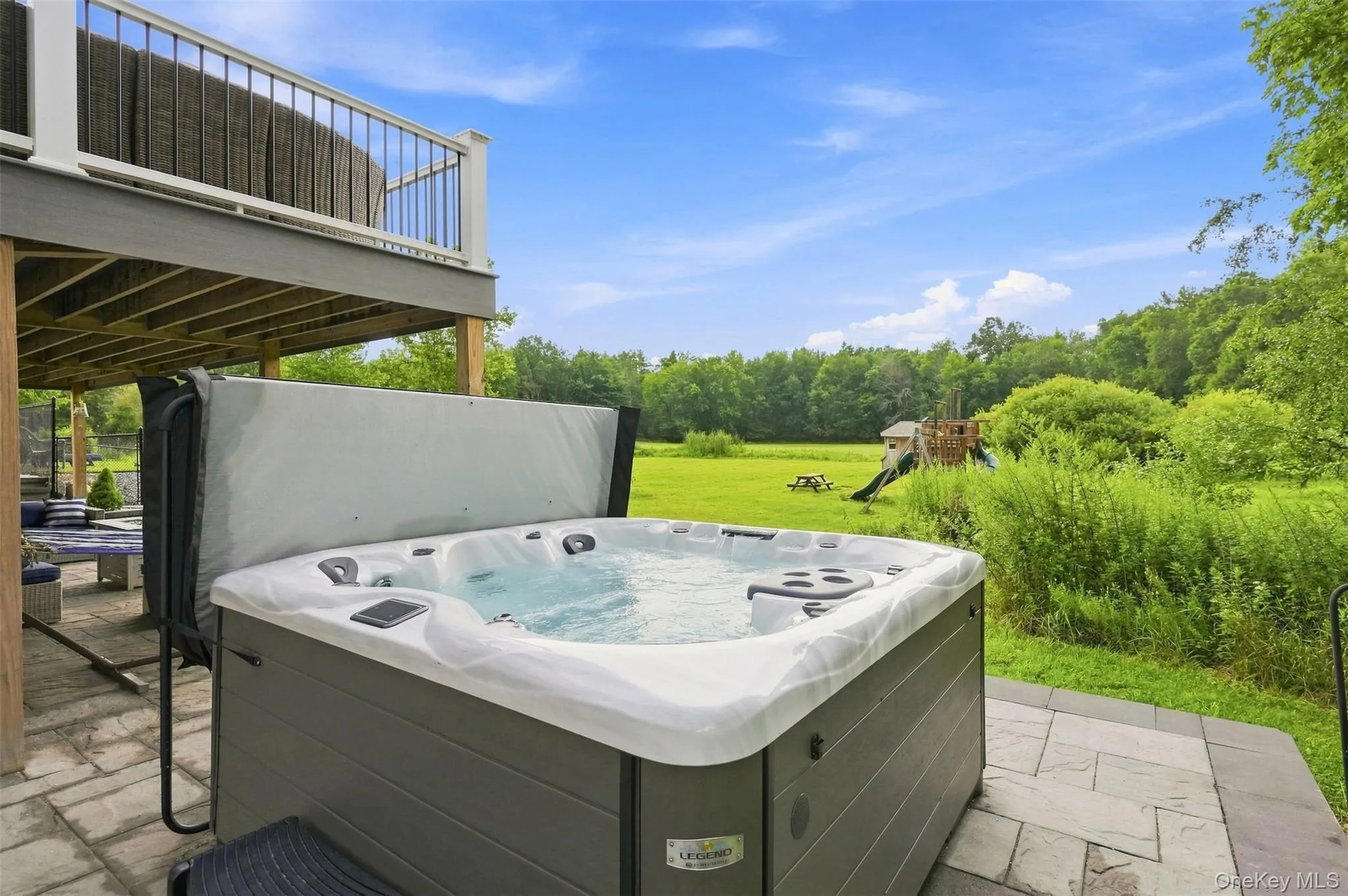 Paver patio easily accessible from the basement or top deck Paver patio easily accessible from the basement or top deck