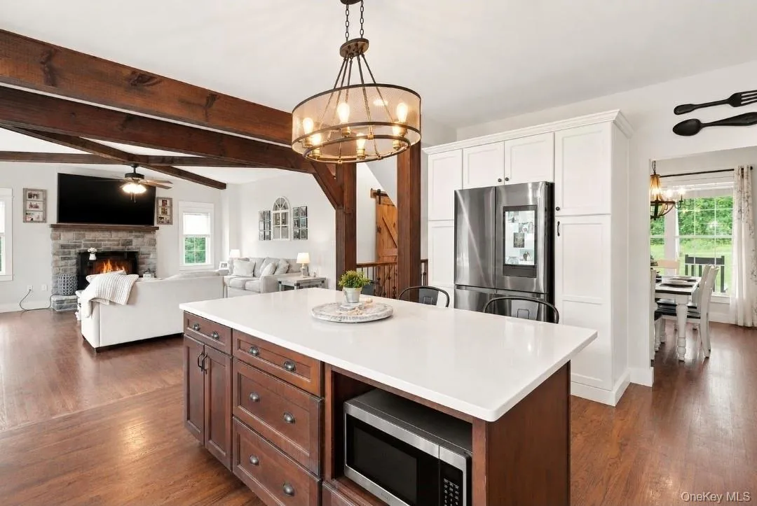 Quartz countertops and oversized island with additional storage and built in microwave Quartz countertops and oversized island with additional storage and built in microwave