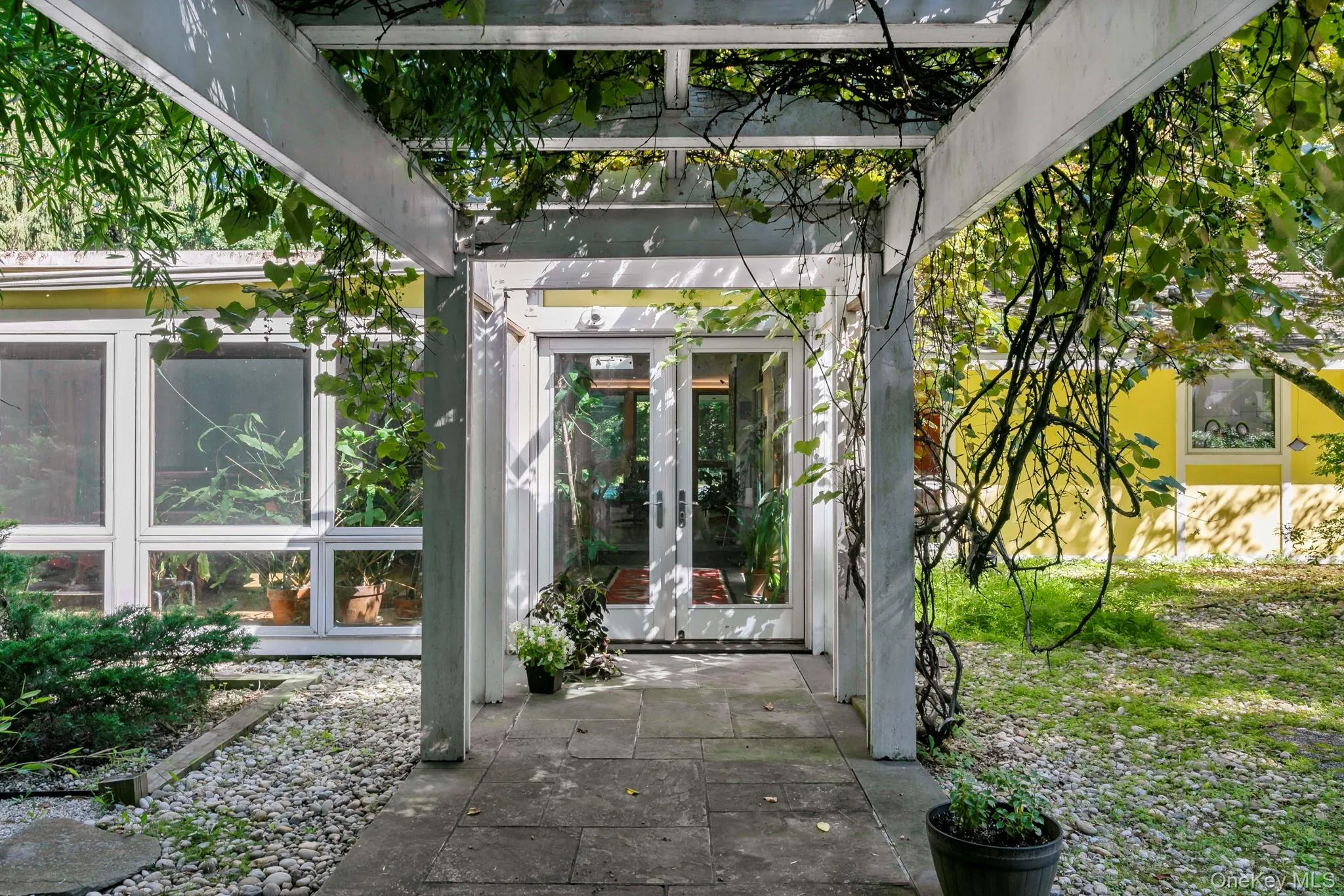 Intimate walkway under a grape covered trellis. Intimate walkway under a grape covered trellis.