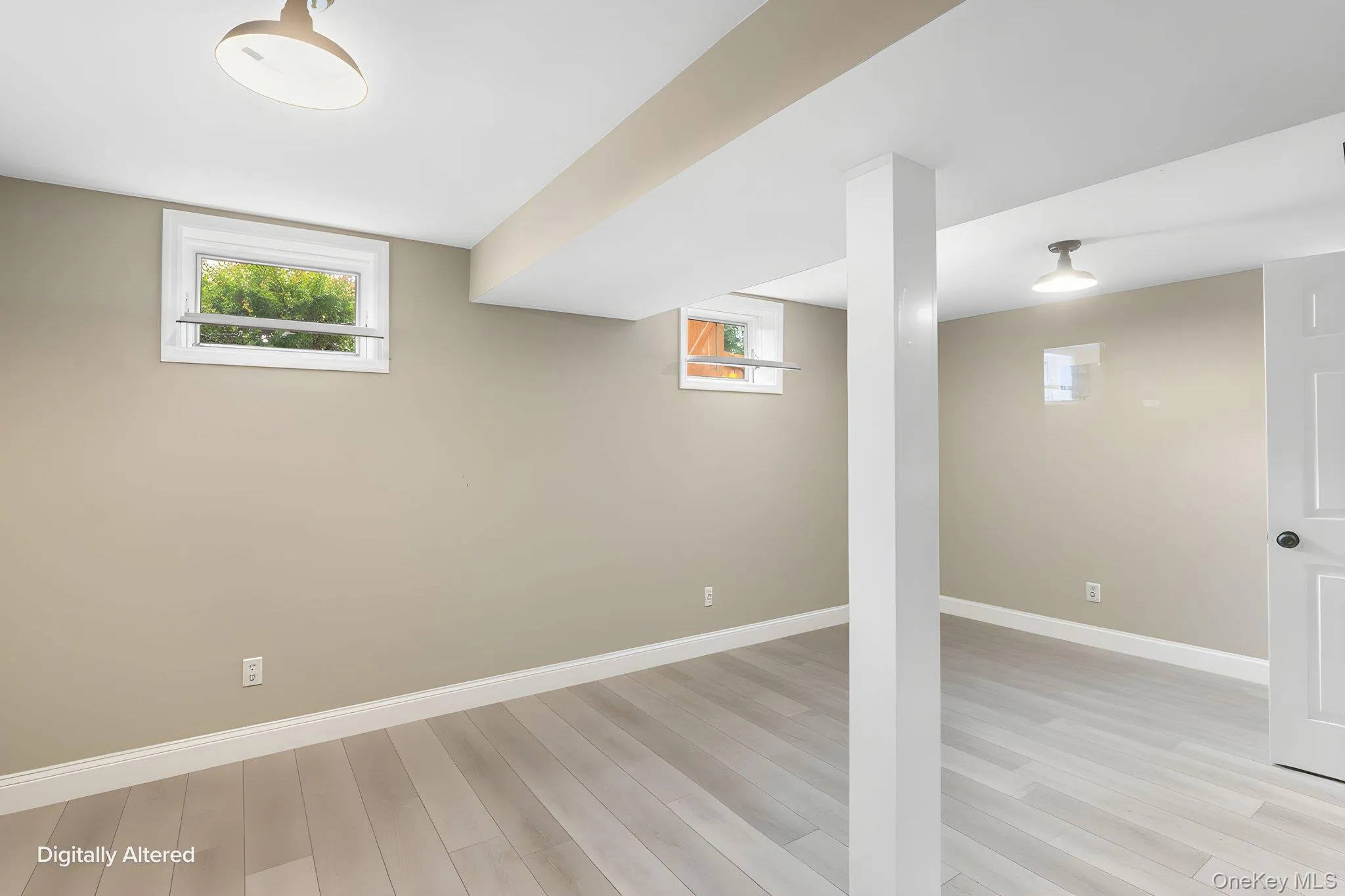 Recessed windows, overhead lighting fixtures, wood-finish flooring, and neutral wall tones Recessed windows, overhead lighting fixtures, wood-finish flooring, and neutral wall tones