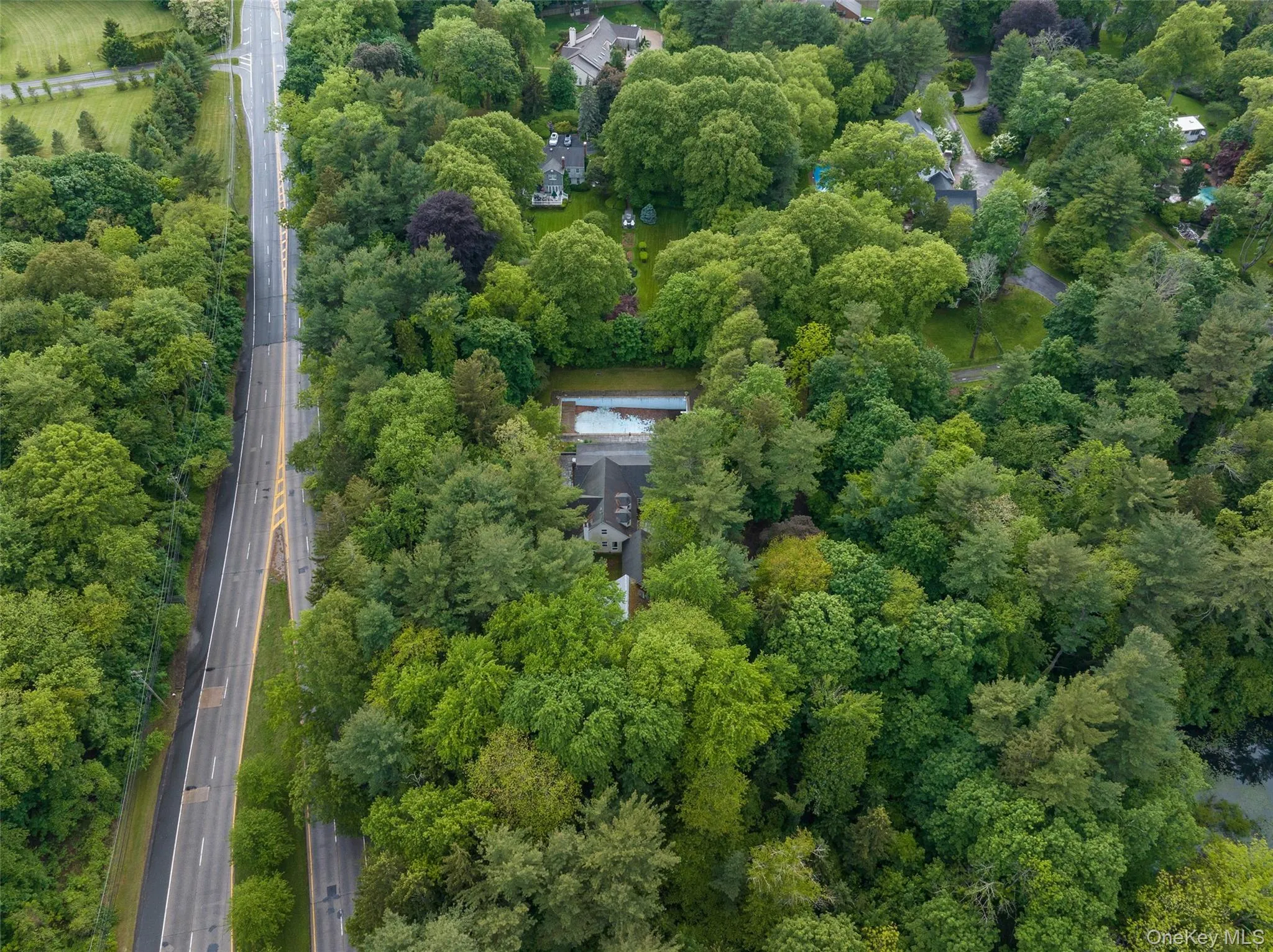 Aerial overview of property's location featuring a highway Aerial overview of property's location featuring a highway