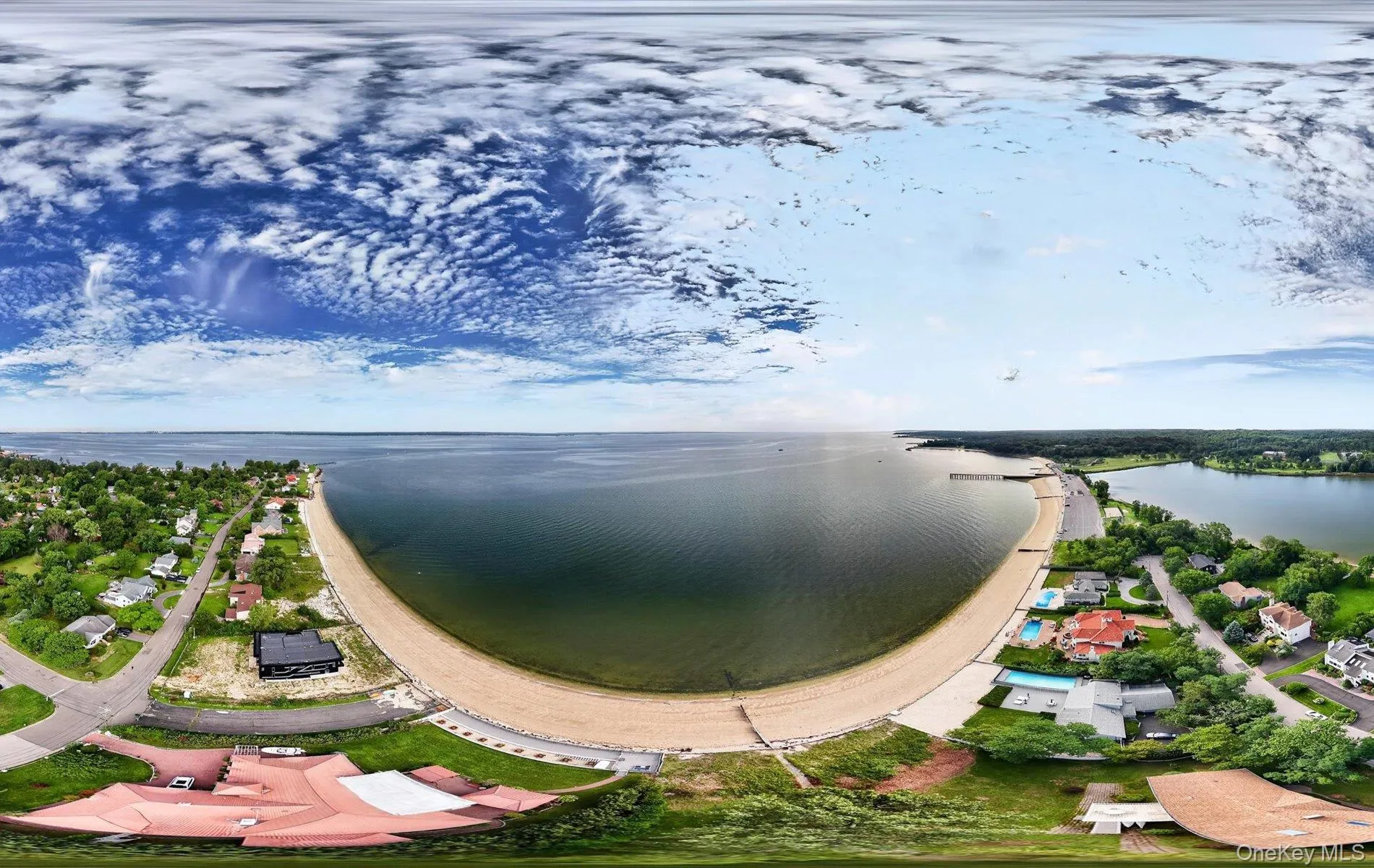 Waterfront property with extensive shoreline, private beach access, and multiple residential structures Waterfront property with extensive shoreline, private beach access, and multiple residential structures