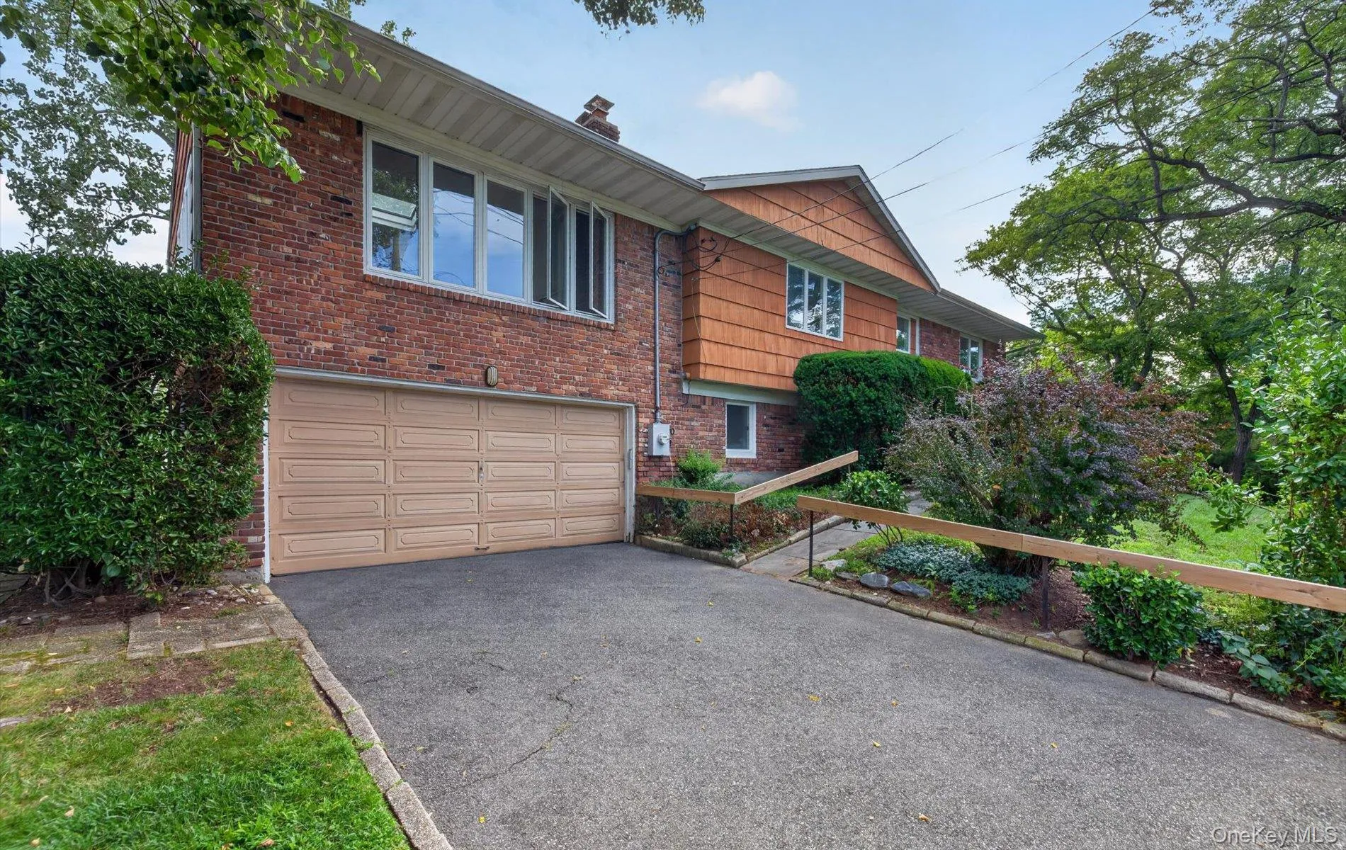 Brick exterior with wood siding accents Brick exterior with wood siding accents