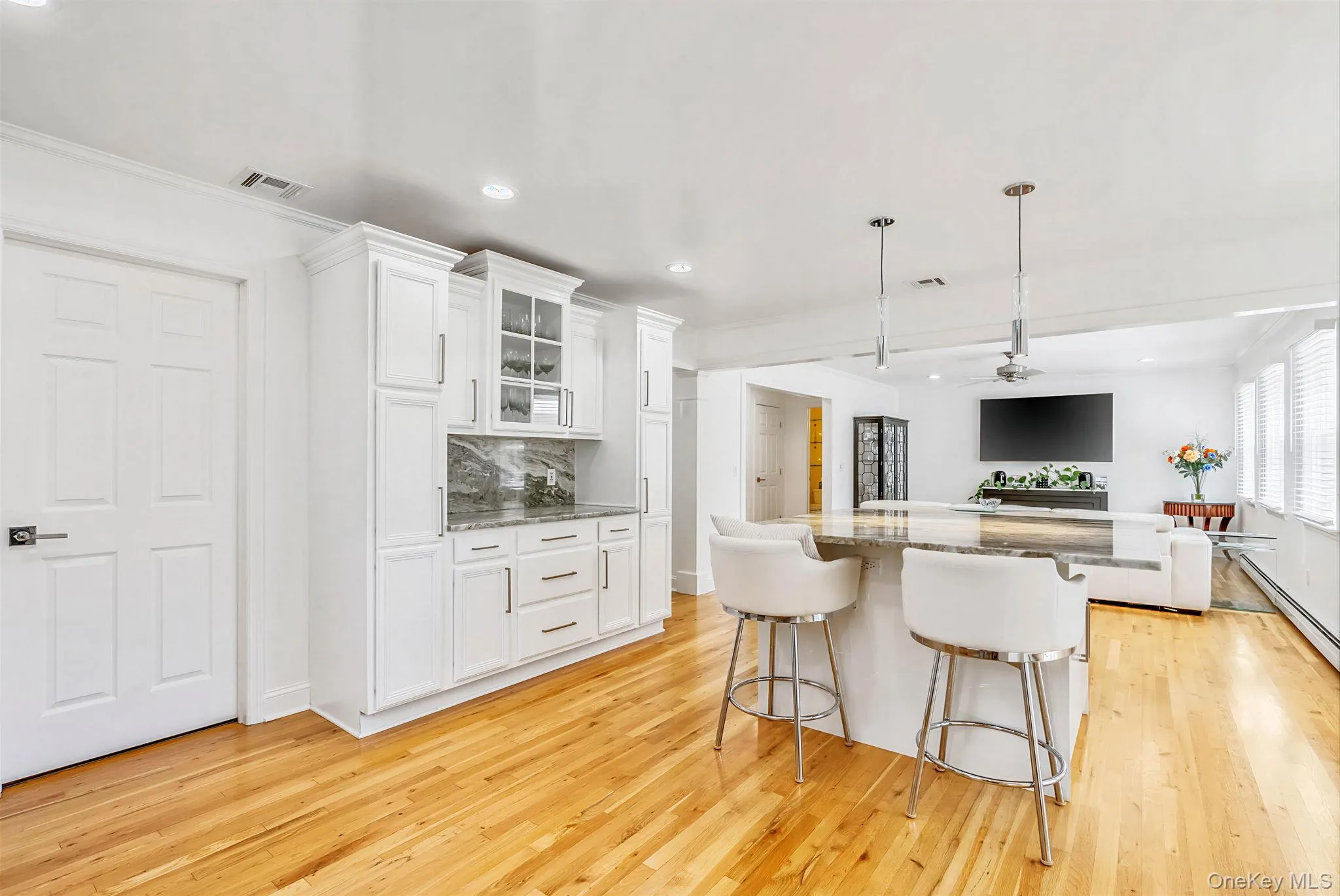 Custom kitchen cabinets, island and hardwood floors. Custom kitchen cabinets, island and hardwood floors.