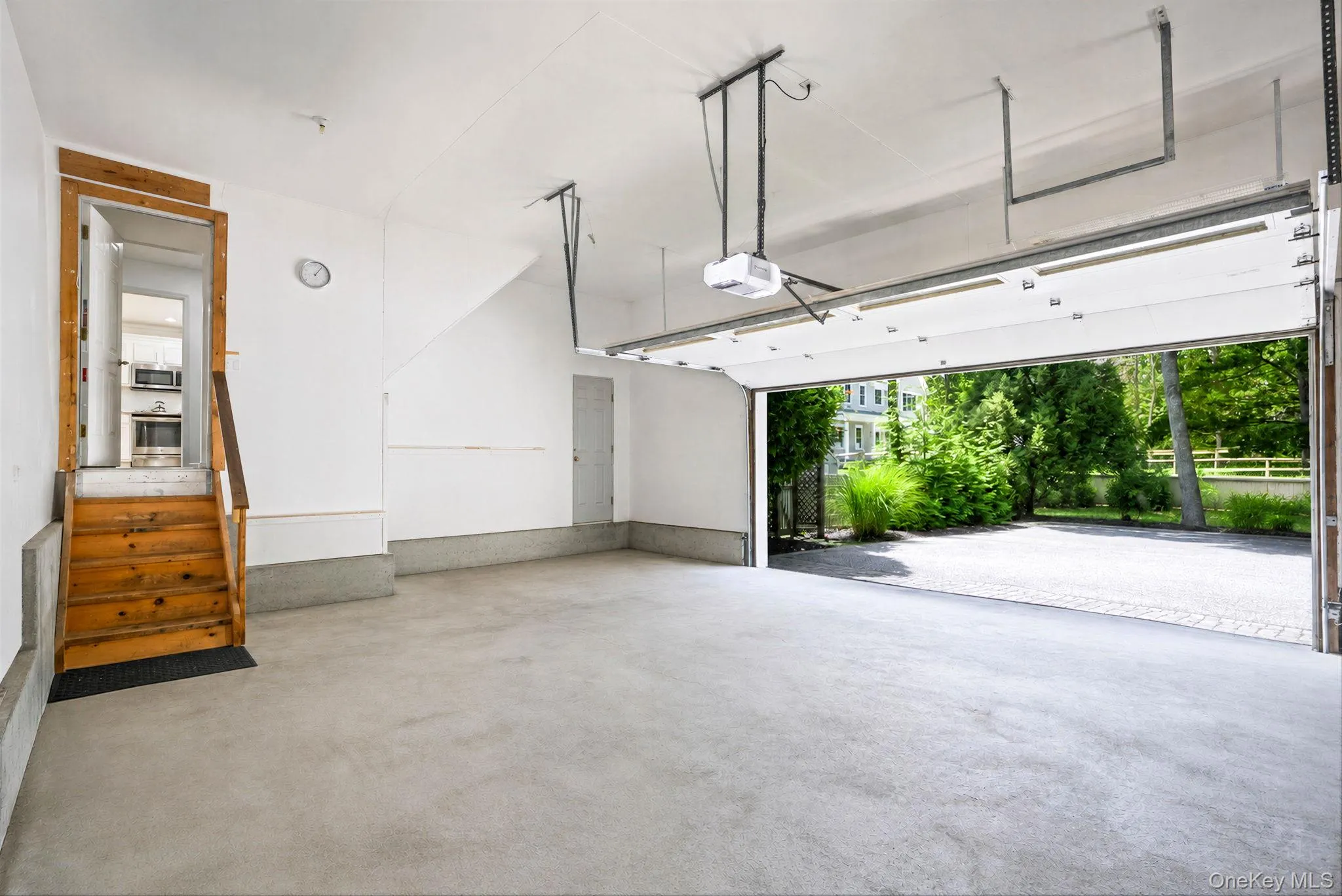 2.5 car garage with 12 foot ceilings and lots of storage space 2.5 car garage with 12 foot ceilings and lots of storage space