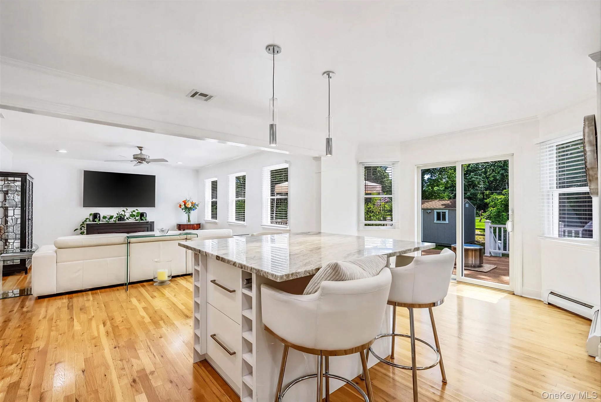 Kitchen island and view of living room Kitchen island and view of living room