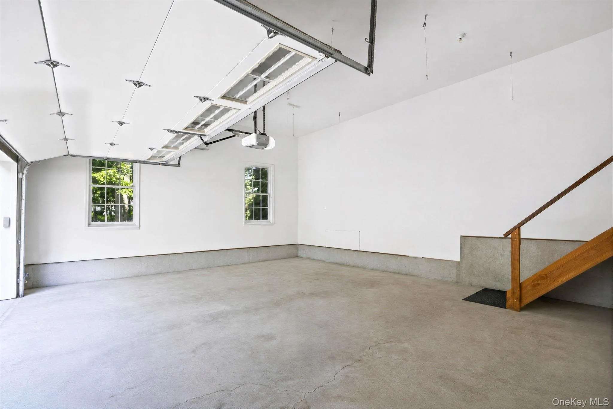2.5 car garage with 12 foot ceilings and lots of storage space 2.5 car garage with 12 foot ceilings and lots of storage space