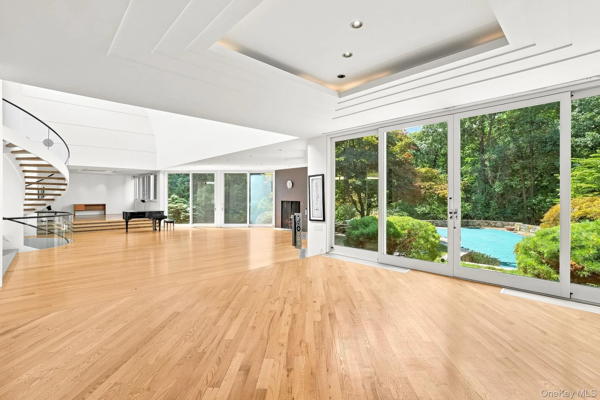 Open floor concept. Living room and dining room with view ceiling to floor sliding doors leading to backyard. Open floor concept. Living room and dining room with view ceiling to floor sliding doors leading to backyard.