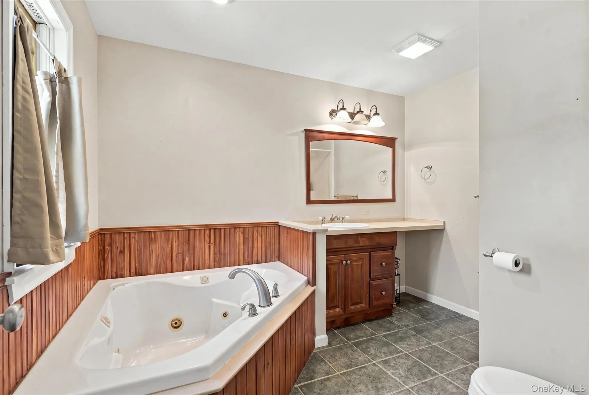 Ensuite bathroom with hot tub and shower Ensuite bathroom with hot tub and shower