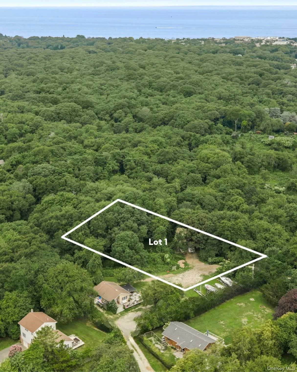 Rare Montauk land opportunity! Lot 1 set on approximately 0.8 acres in a private, wooded setting, this exceptional parcel offers a unique opportunity to create a custom Montauk retreat.