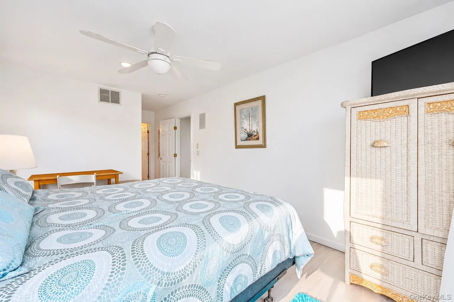 En Suite featuring large walk-in closets