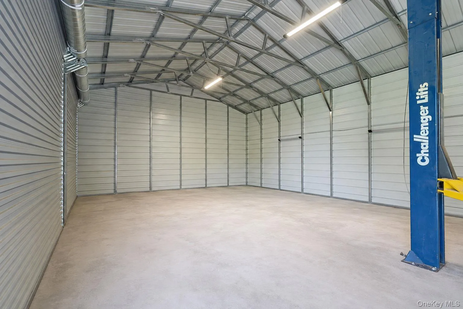 Four bay garage with lift digitally emptied out Four bay garage with lift digitally emptied out
