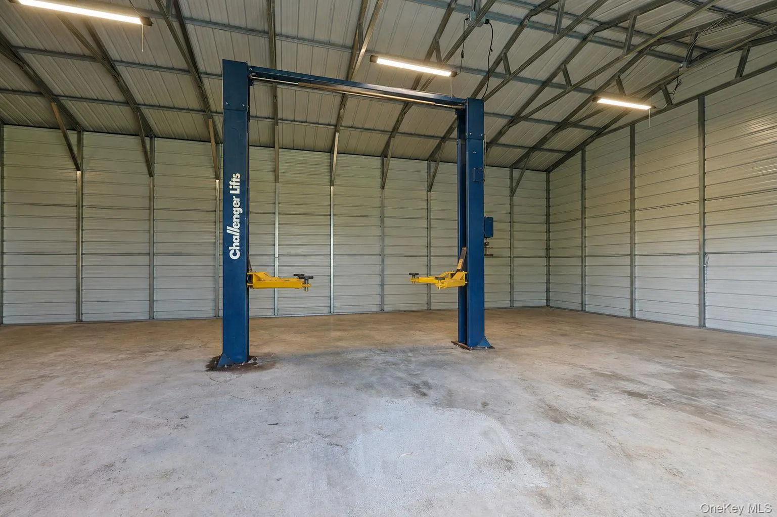 Four bay garage with lift digitally emptied out Four bay garage with lift digitally emptied out