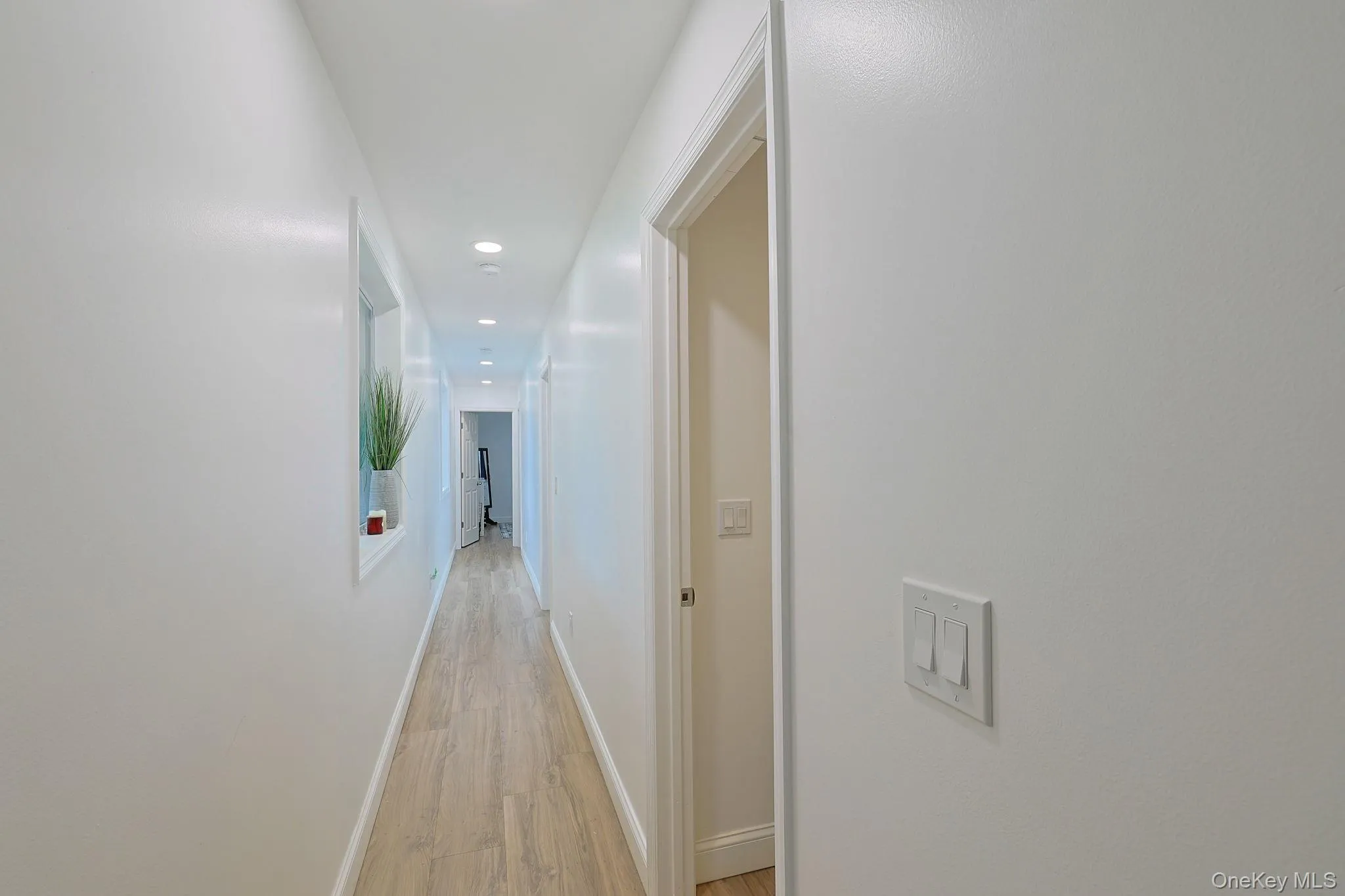 Long hallway with 3 bedrooms and 1 bathroom Long hallway with 3 bedrooms and 1 bathroom