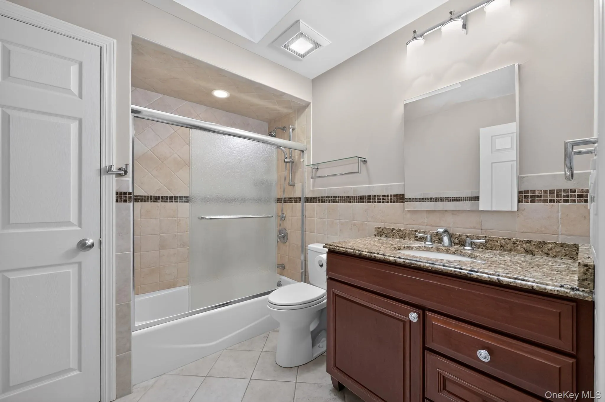 Newly Renovated Hallway Bathroom With Custom Tile and Soaking Tub Newly Renovated Hallway Bathroom With Custom Tile and Soaking Tub