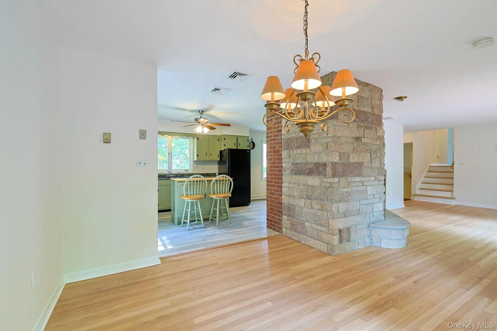 Lovely brick in living room/ dining room Lovely brick in living room/ dining room