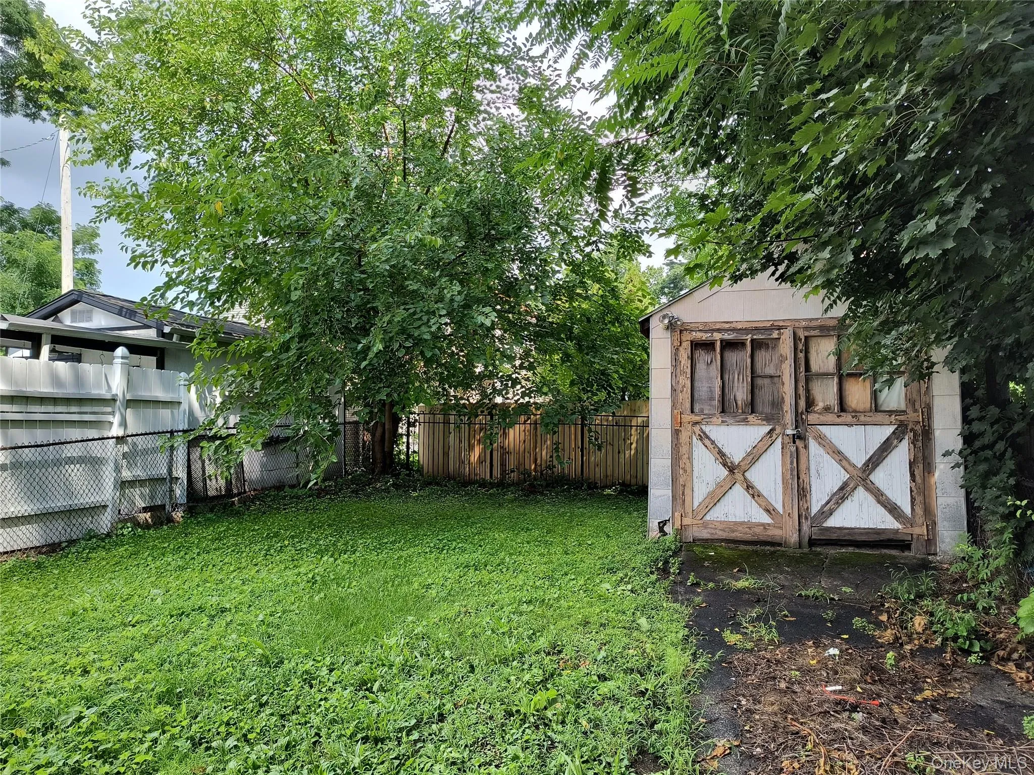 Yard is fairly private with fence and trees! Yard is fairly private with fence and trees!