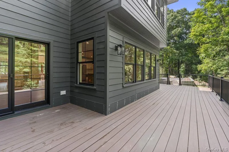Oversized deck with 2 entrances into the house Oversized deck with 2 entrances into the house