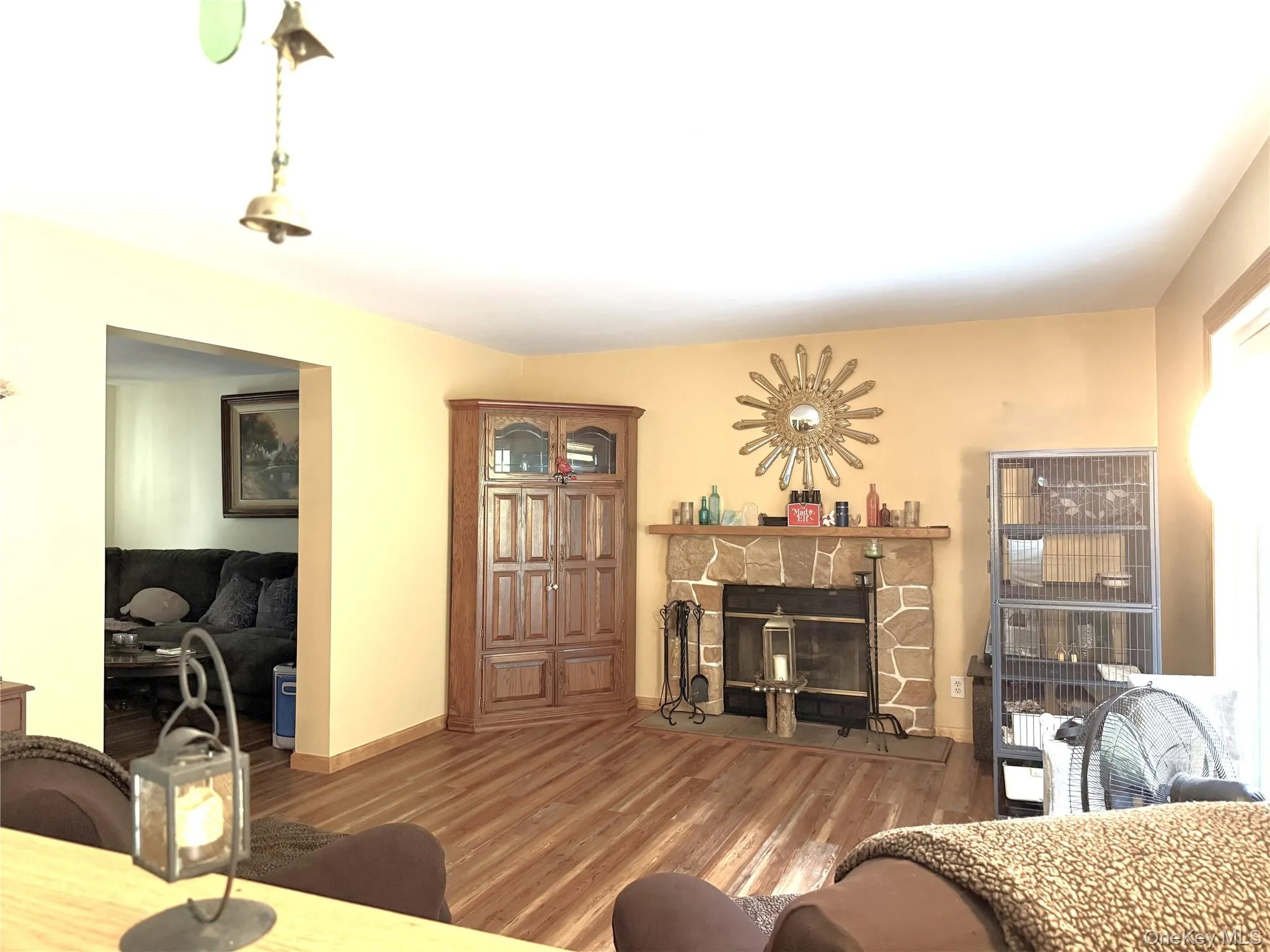As seen from kitchen. Wood-burning fireplace, sliding door to large deck, open to living room. As seen from kitchen. Wood-burning fireplace, sliding door to large deck, open to living room.
