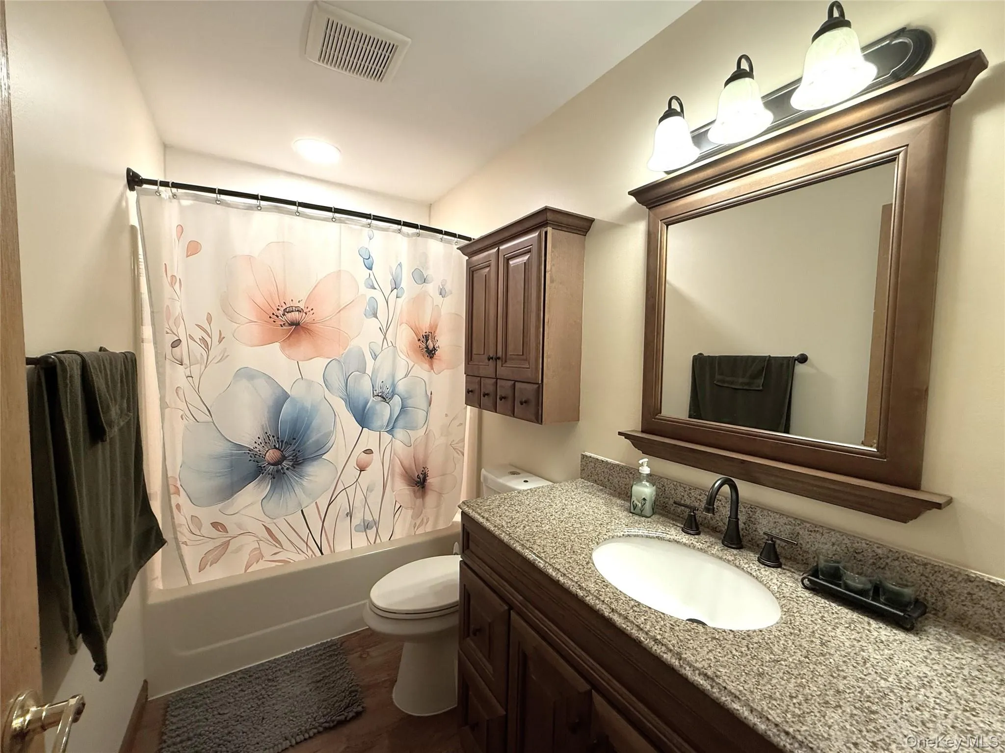 2nd floor full bath. Vanity with granite top. 2nd floor full bath. Vanity with granite top.