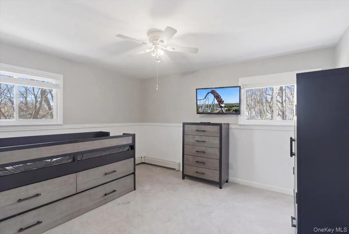 Recessed lighting, wall-to-wall carpeting, and a ceiling fan with light fixture Recessed lighting, wall-to-wall carpeting, and a ceiling fan with light fixture
