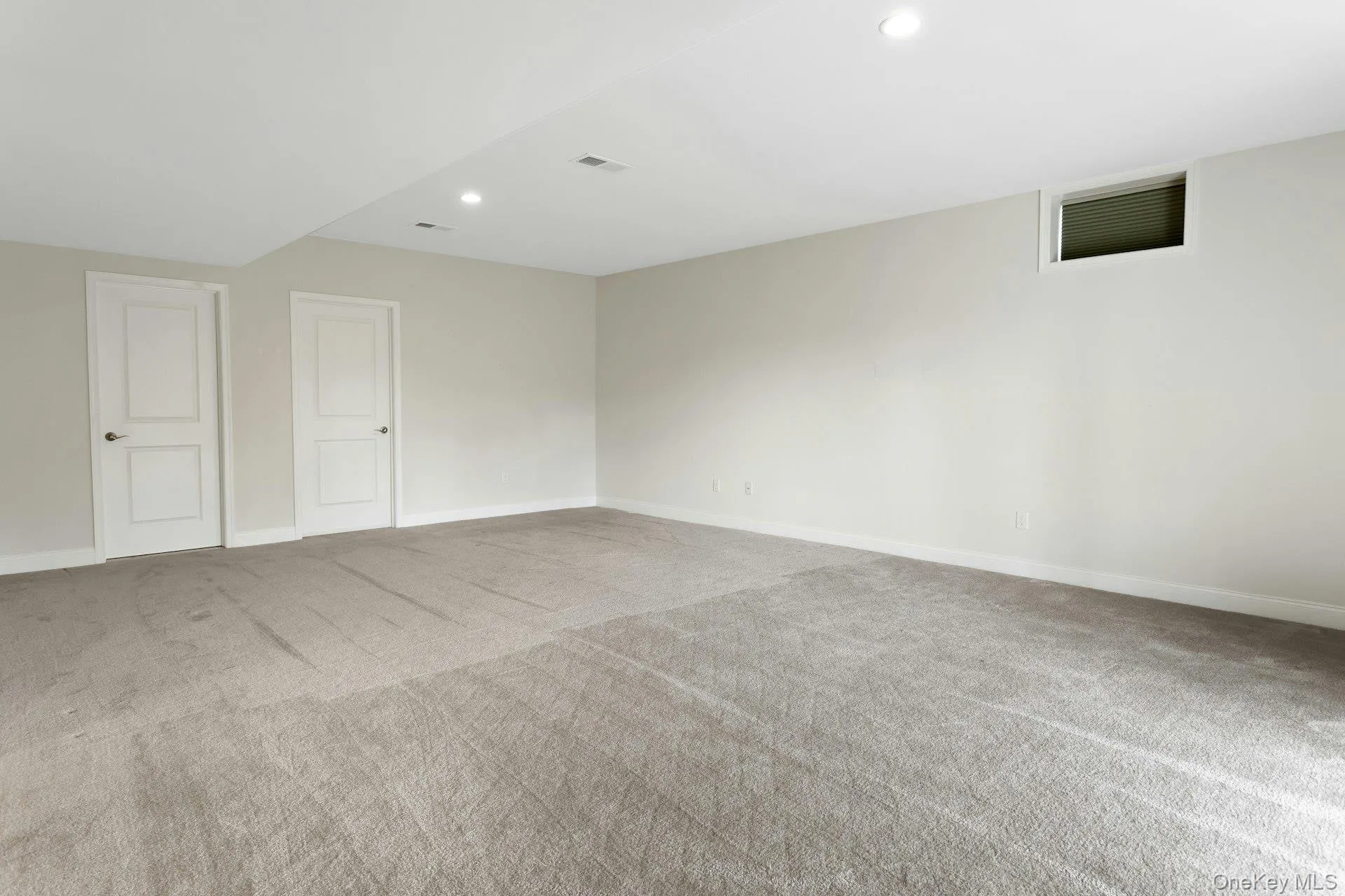 This View Of The Family Room Shows Doors To Powder Room And Storage Area This View Of The Family Room Shows Doors To Powder Room And Storage Area