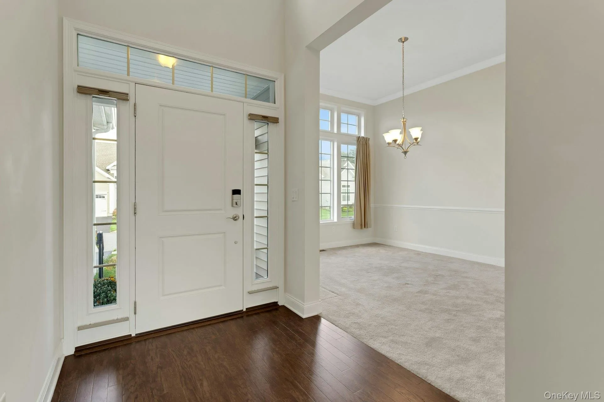 This Very Impressive Entrance Foyer Has High Ceilings And Hardwood Floors This Very Impressive Entrance Foyer Has High Ceilings And Hardwood Floors