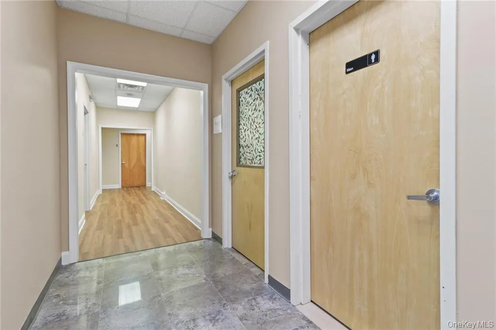 Hallway of the first floor with common areas bathrooms and elevator... Hallway of the first floor with common areas bathrooms and elevator...