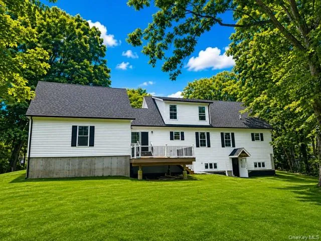 Expansive rear view showcasing the full walkout basement, 16' × 16' Trex deck, private backyard, mature trees, and generous outdoor space. Expansive rear view showcasing the full walkout basement, 16' × 16' Trex deck, private backyard, mature trees, and generous outdoor space.