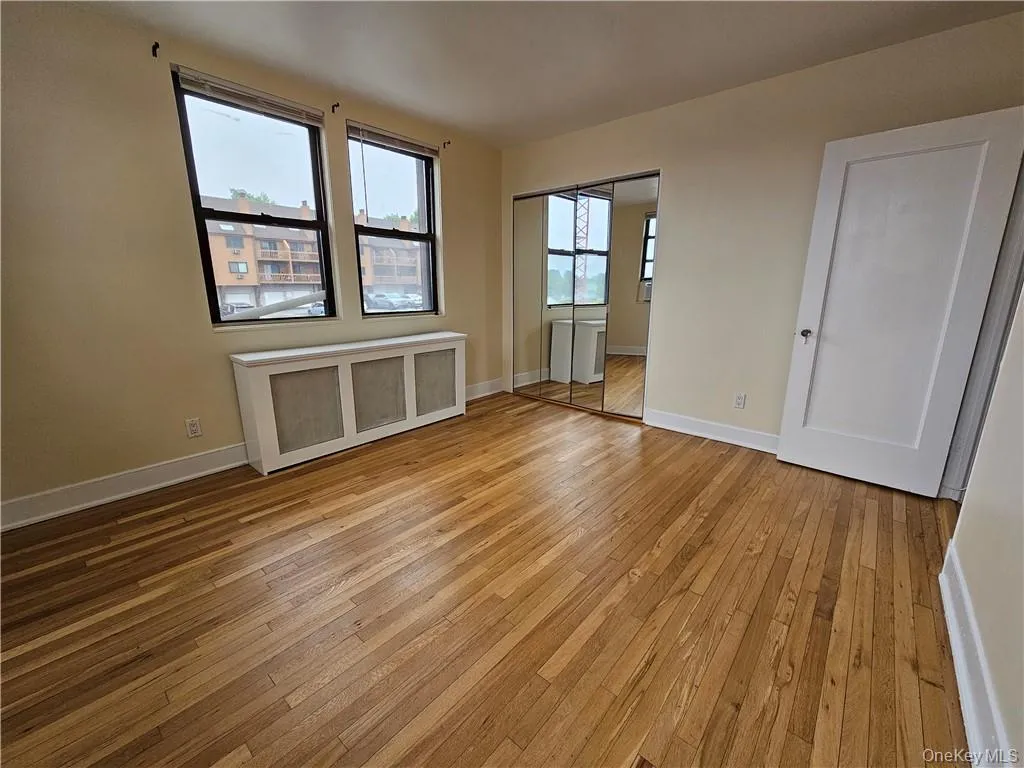 Bright bedroom featuring hardwood floors and excellent closet space! Bright bedroom featuring hardwood floors and excellent closet space!