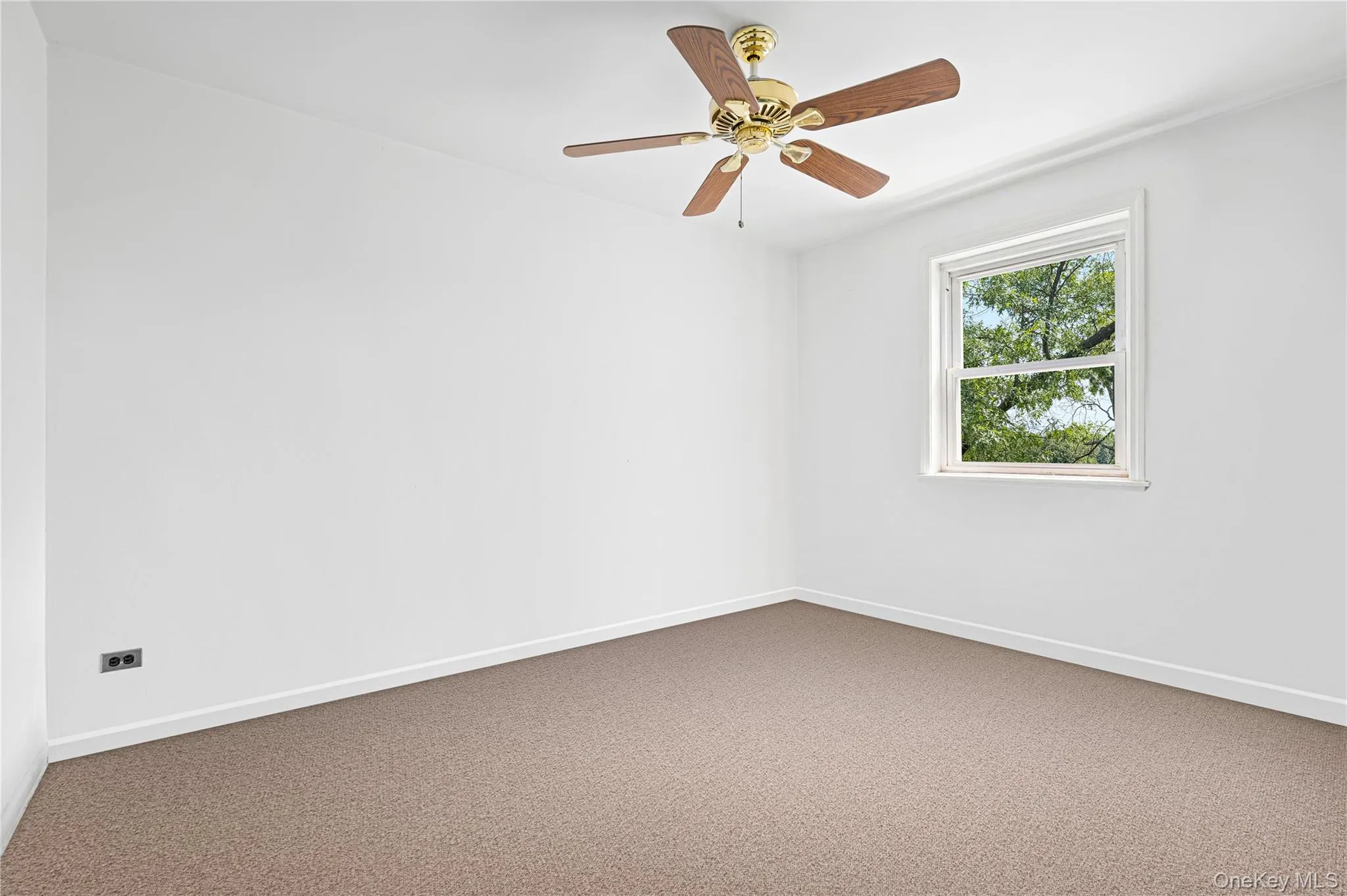 Neutral wall paint throughout, warm-toned carpeting, and a ceiling fan with integrated lighting Neutral wall paint throughout, warm-toned carpeting, and a ceiling fan with integrated lighting