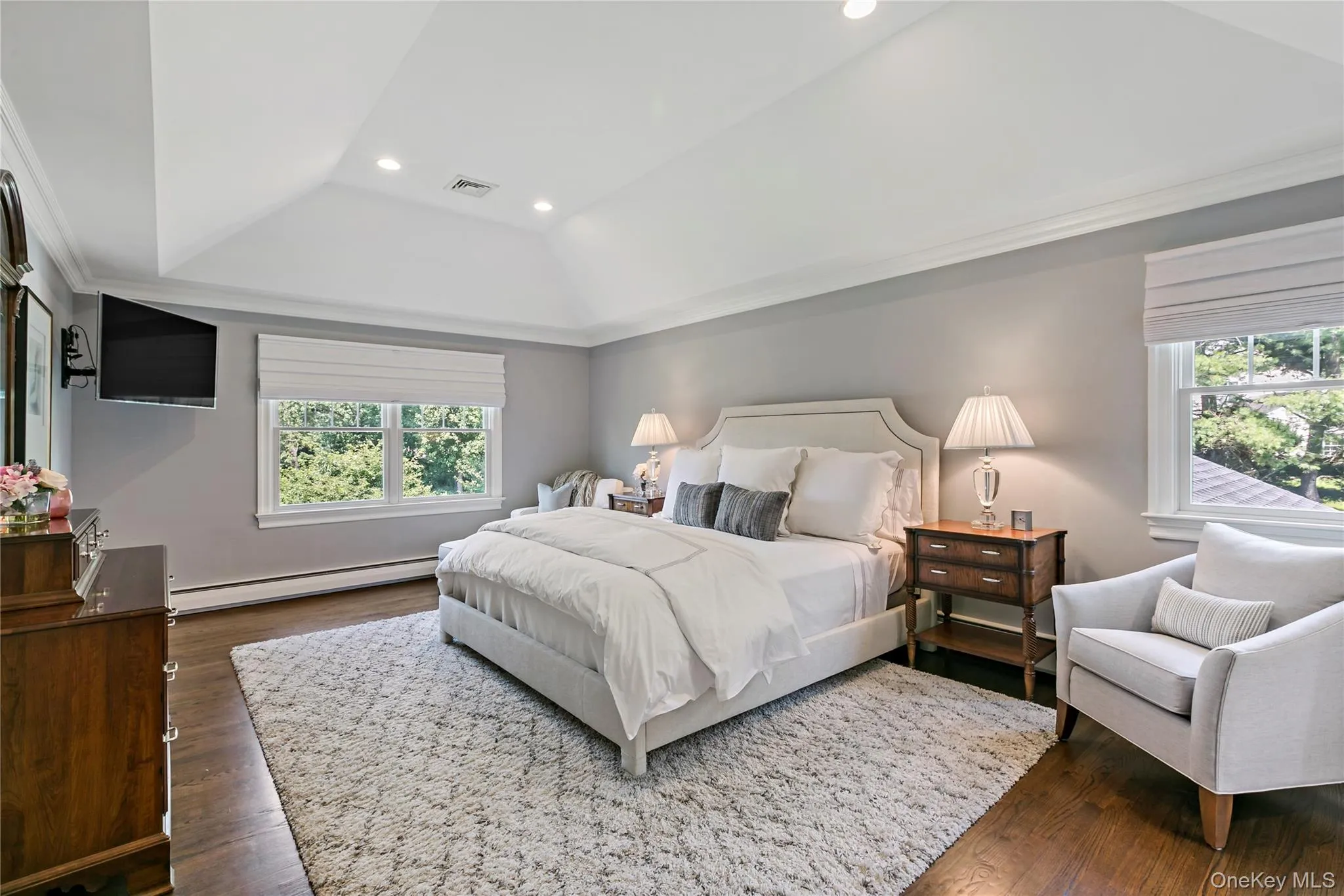 The Large Primary Bedroom has a Tray Ceiling, Marble Bathroom, a Walk-In Closet and ample Space for Causal Sitting The Large Primary Bedroom has a Tray Ceiling, Marble Bathroom, a Walk-In Closet and ample Space for Causal Sitting