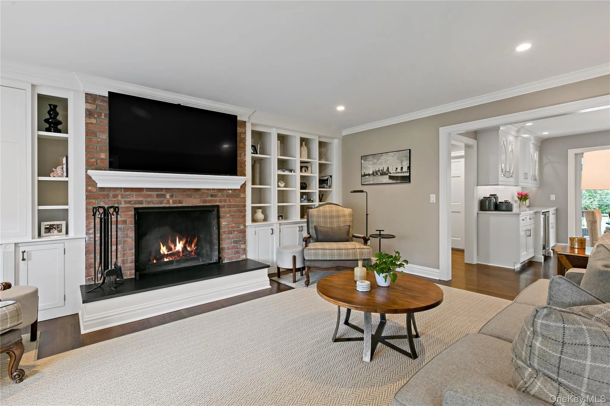 Family Room Flows Generously from the Kitchen and has a Wood Burning Fireplace Family Room Flows Generously from the Kitchen and has a Wood Burning Fireplace