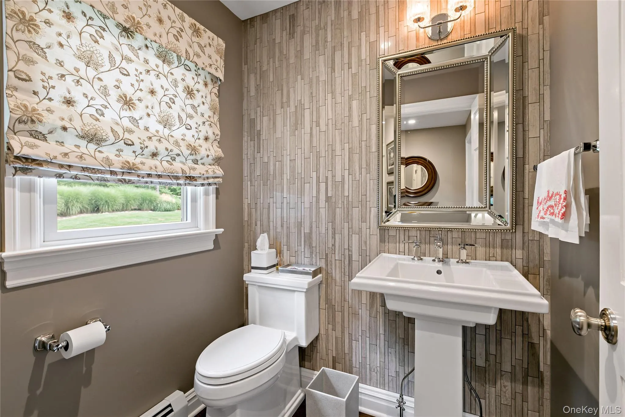 Powder Room on First Floor with a Marble Accent Wall Powder Room on First Floor with a Marble Accent Wall
