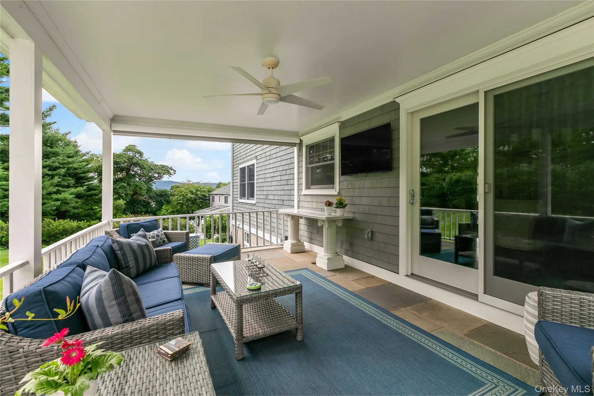 A Covered Porch with Hudson River Views off Kitchen with a TV and Shade on Far Side A Covered Porch with Hudson River Views off Kitchen with a TV and Shade on Far Side