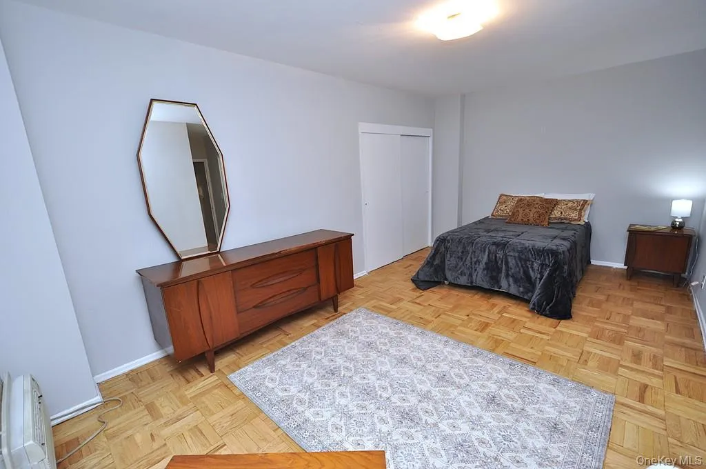 Primary bedroom has parquet floors and private bath with step in shower. The bedroom is large enough to accommodate a king size bedroom set and still have room for a comfy reading chair. The room is approx 18'-10" x 15'-5". Primary bedroom has parquet floors and private bath with step in shower. The bedroom is large enough to accommodate a king size bedroom set and still have room for a comfy reading chair. The room is approx 18'-10" x 15'-5".