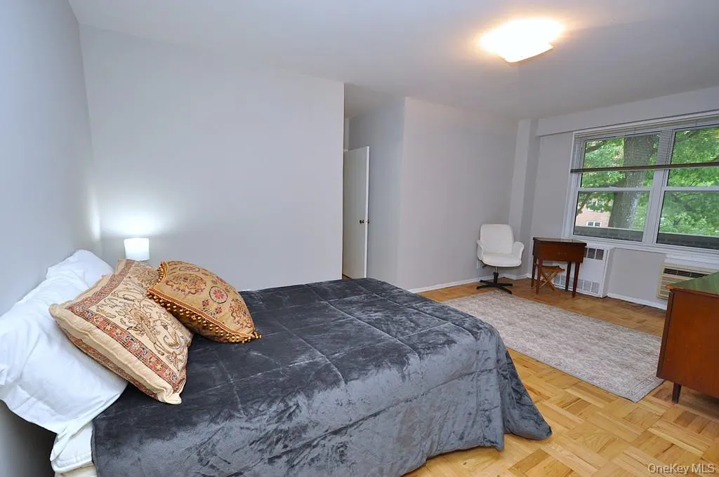 Primary bedroom has parquet floors and private bath with step in shower. The bedroom is large enough to accommodate a king size bedroom set and still have room for a comfy reading chair. The room is approx 18'-10" x 15'-5". Primary bedroom has parquet floors and private bath with step in shower. The bedroom is large enough to accommodate a king size bedroom set and still have room for a comfy reading chair. The room is approx 18'-10" x 15'-5".