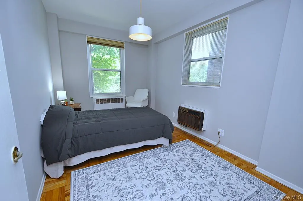 Corner Second Bedroom has a walk-in closet, parquet floors and can be used as a home office, den or guest room. The bedroom is approx 13'-1" x 8'-10". Corner Second Bedroom has a walk-in closet, parquet floors and can be used as a home office, den or guest room. The bedroom is approx 13'-1" x 8'-10".
