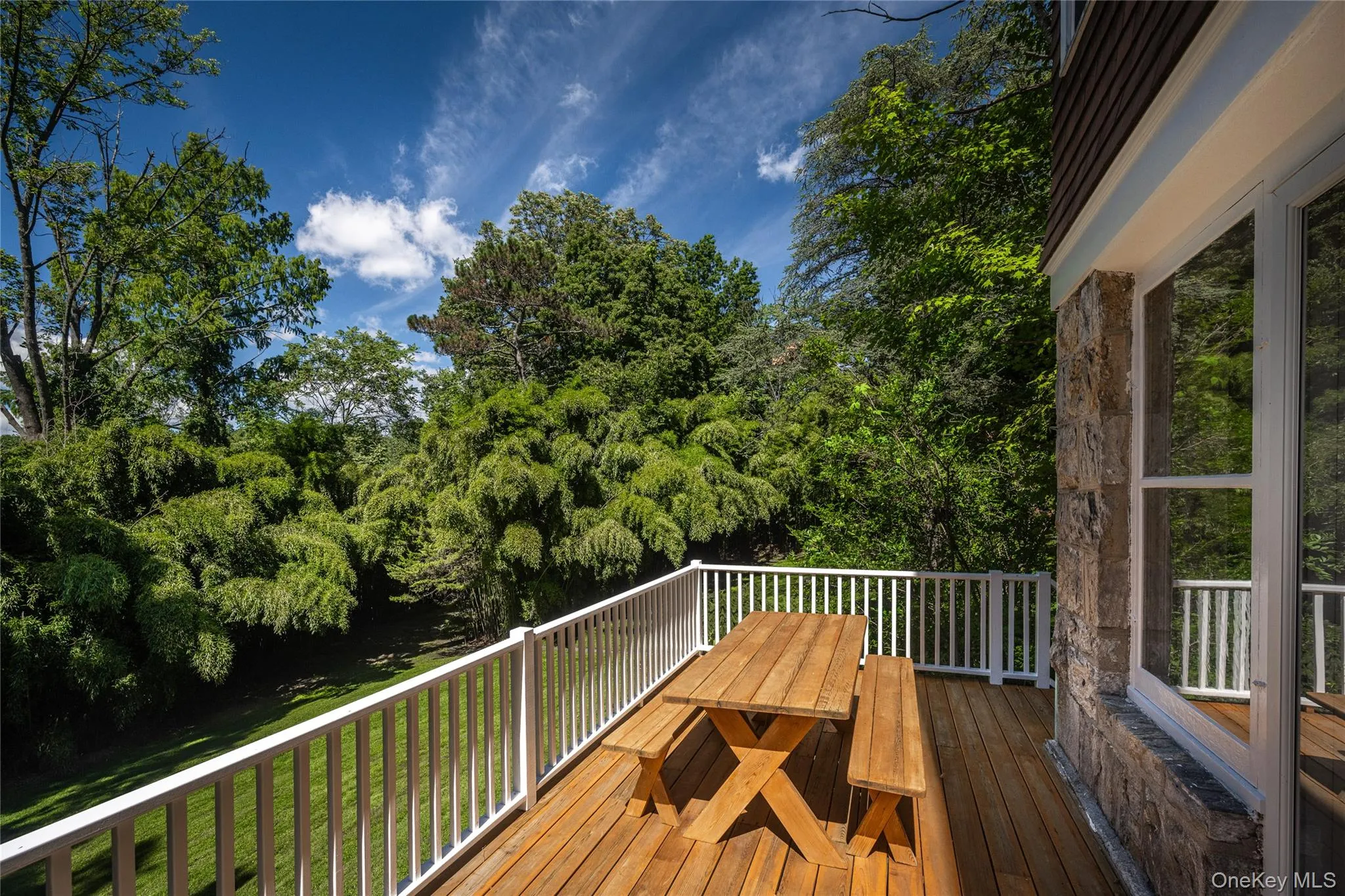 Deck off of the dining room overlooking the gorgeous grounds Deck off of the dining room overlooking the gorgeous grounds