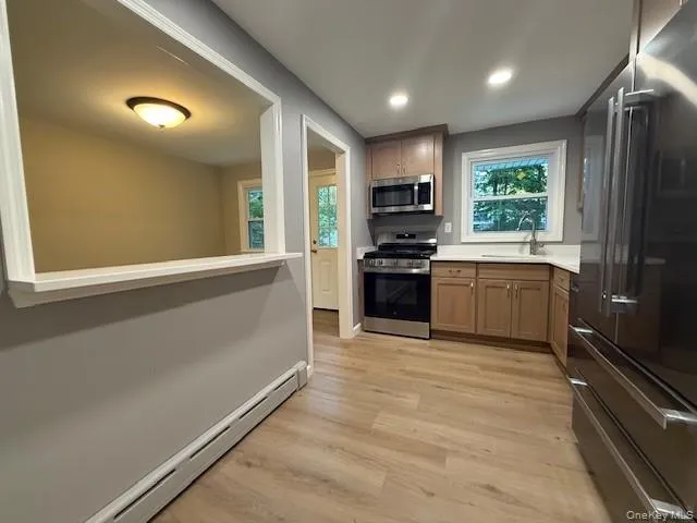 View in to the Dining area from your kitchen. View in to the Dining area from your kitchen.