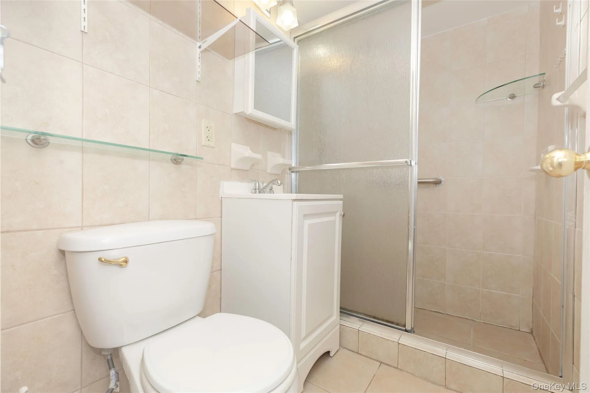 Renovated bathroom with shower stall. Renovated bathroom with shower stall.